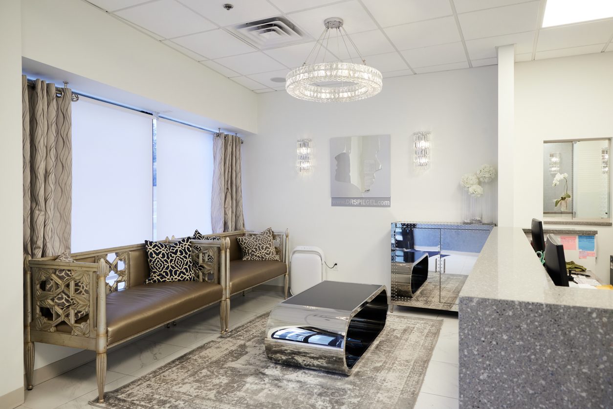 Patient waiting room and reception desk at Nova Medical Hair Transplant Boston on Boylston Street in Newton, MA